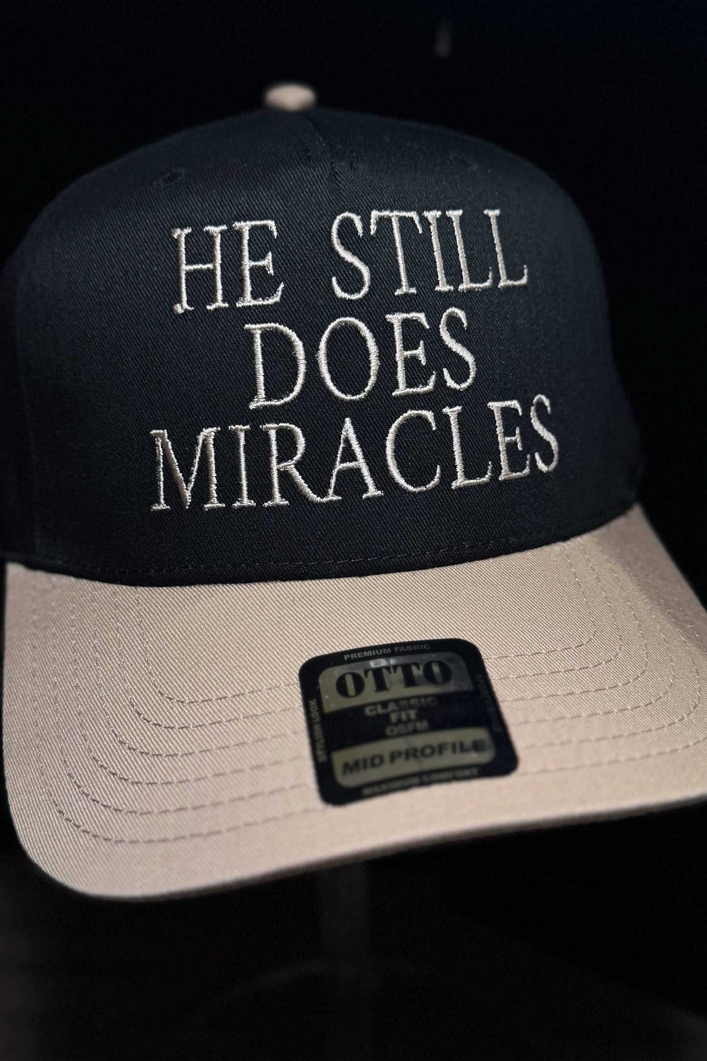 HE STILL DOES MIRACLES EMBROIDERED TRUCKER CAP